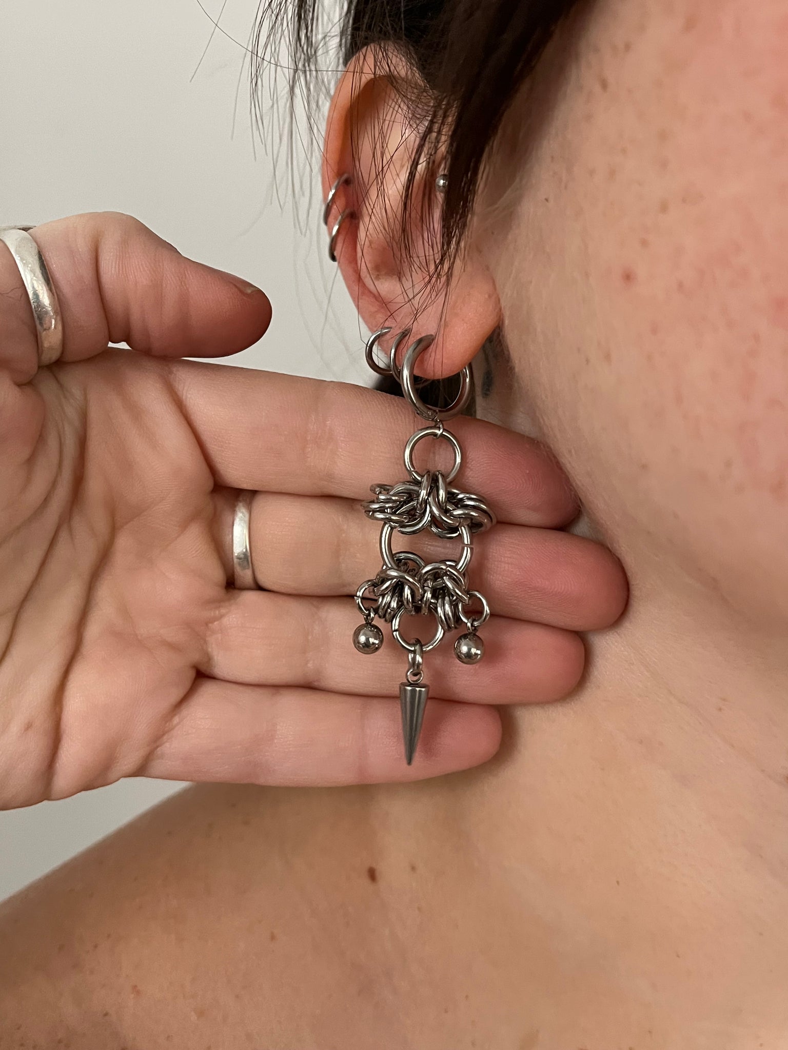 The “CAGED” earrings