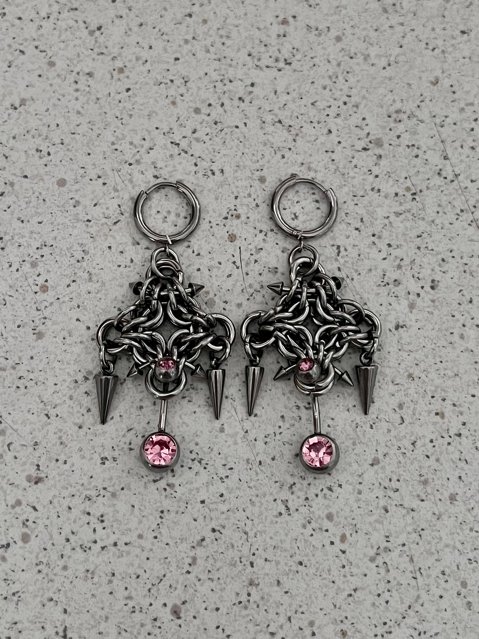 The “BELLY RING” earrings