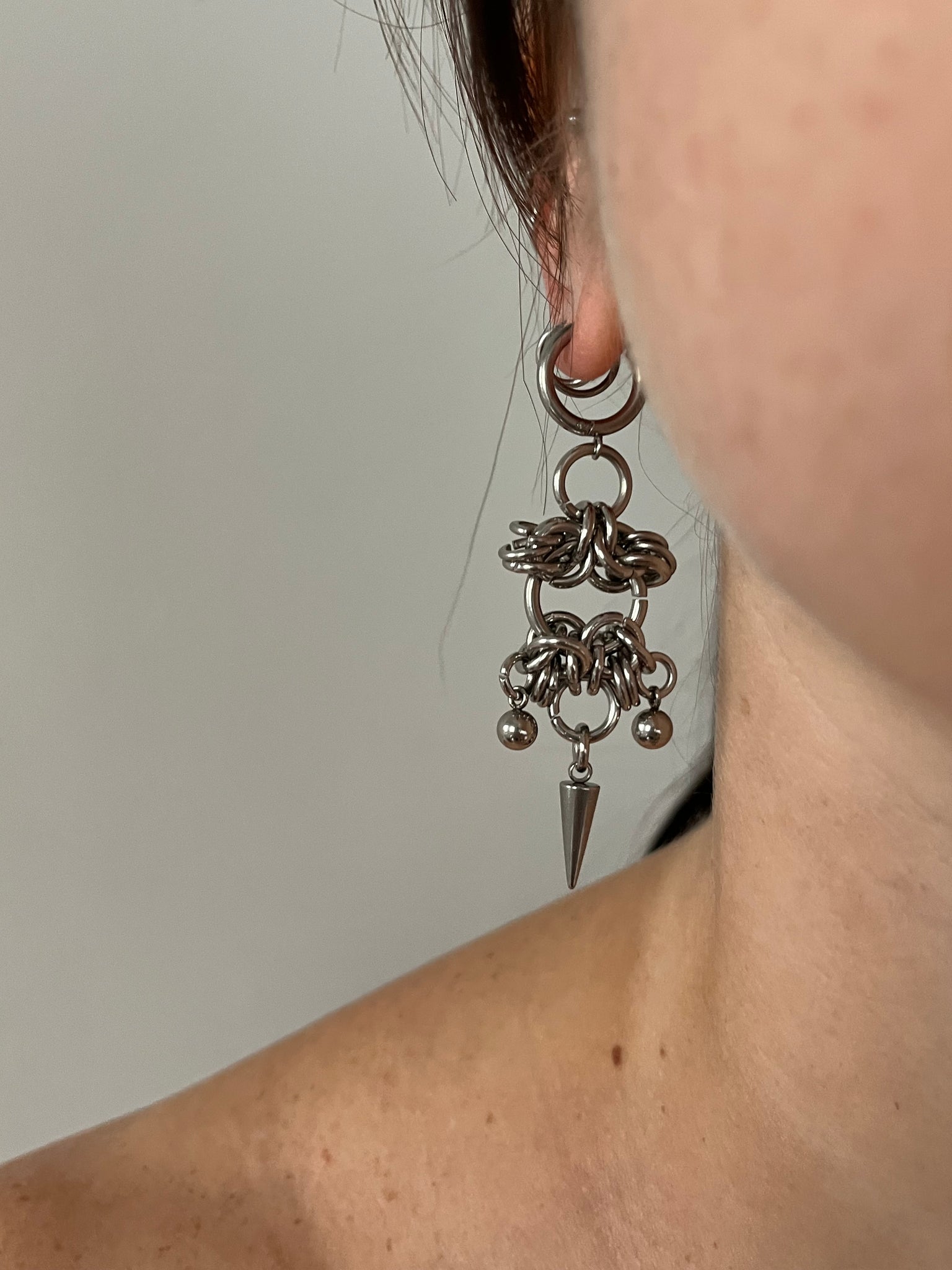 The “CAGED” earrings